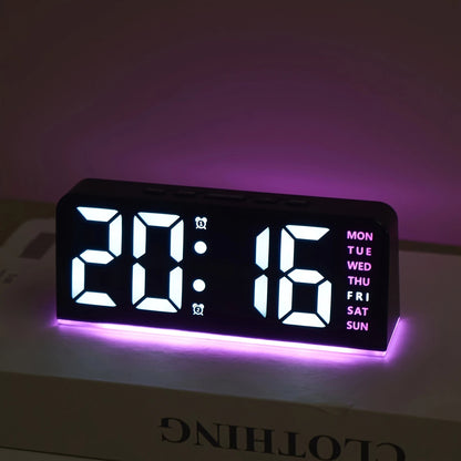 Digital clock with LED display on a white surface with a purple background